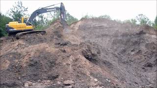 Excavator Pulling Down Stockpile [upl. by Bride]