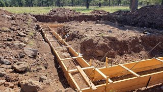 DIY Concrete Forms Forming the foundation footings [upl. by Chrystal534]